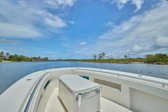  Yacht Photos Pics Invincible 36 boat on calm waters under a clear blue sky, 2015 model.
