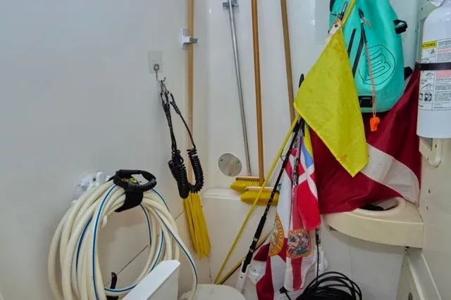  Yacht Photos Pics Storage area on a 2015 Invincible 36 boat with flags, hoses, and equipment.
