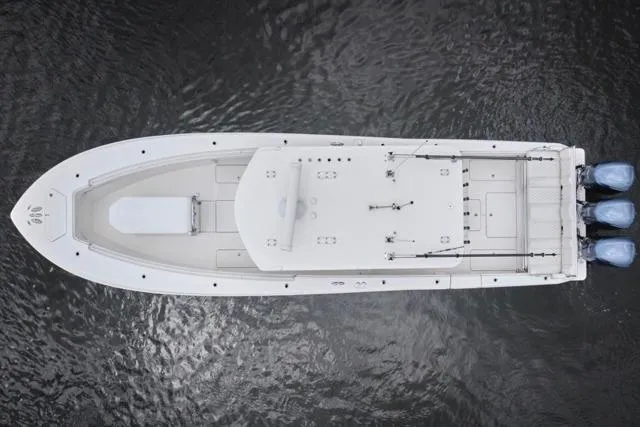  Yacht Photos Pics Aerial view of 2015 Invincible 36 boat with triple engines on water.