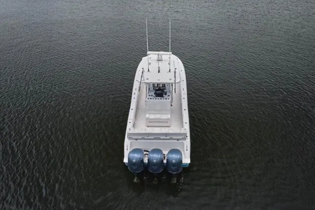  Yacht Photos Pics Overhead view of 2015 Invincible 36 boat with triple engines on water.