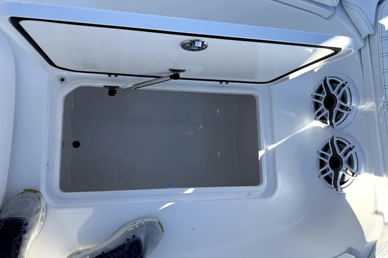  Yacht Photos Pics 2024 Contender 25 Bay boat storage compartment with speakers and open hatch.