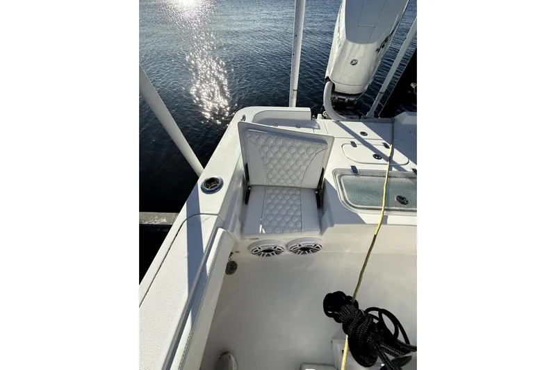  Yacht Photos Pics 2024 Contender 25 Bay boat interior with cushioned seating and water reflection.