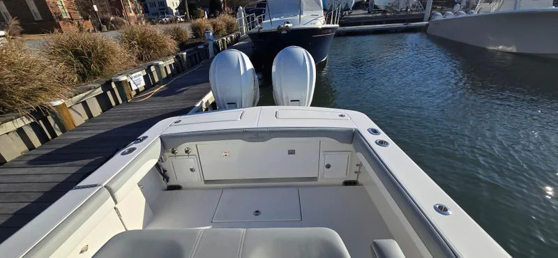 Wound Tight Yacht Photos Pics 2021 Regulator 34 Center Console boat docked with twin engines.