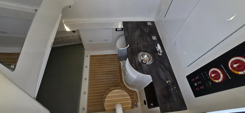 Wound Tight Yacht Photos Pics 2021 Regulator 34 Center Console interior with modern amenities and sleek design.