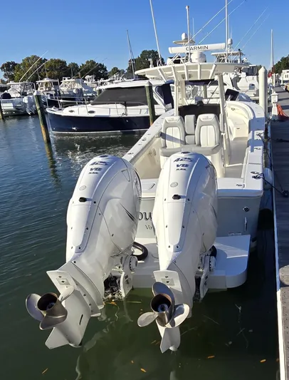 Wound Tight Yacht Photos Pics 2021 Regulator 34 Center Console boat docked with twin outboard engines.