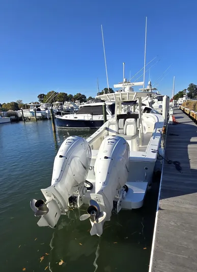 Wound Tight Yacht Photos Pics 2021 Regulator 34 Center Console boat docked with dual outboard engines.