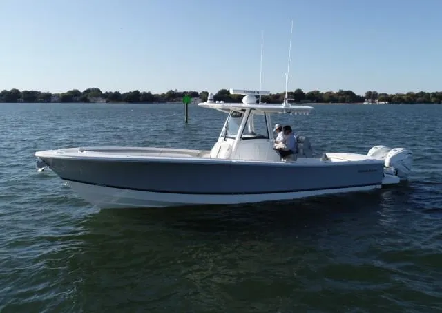 Wound Tight Yacht Photos Pics 2021 Regulator 34 Center Console boat on calm water.