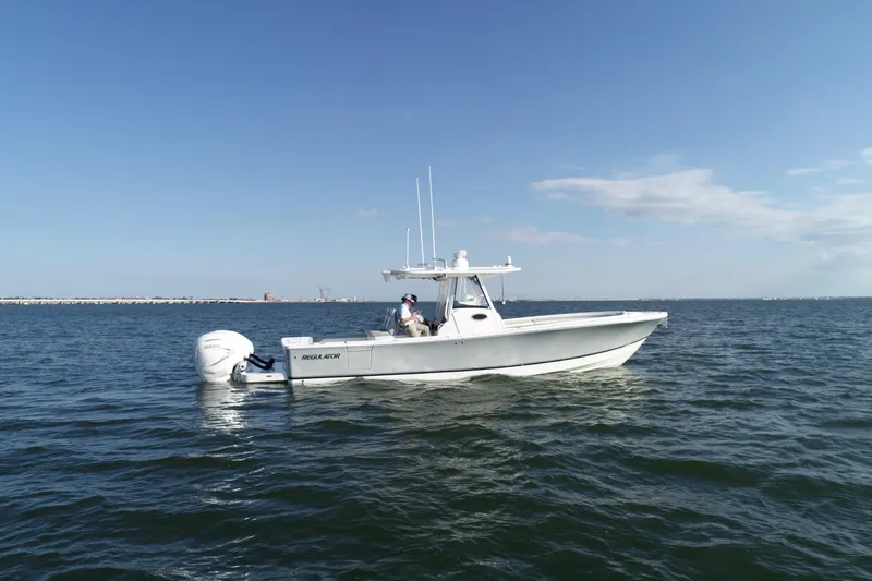 Wound Tight Yacht Photos Pics 2021 Regulator 34 Center Console boat on open water under clear sky.