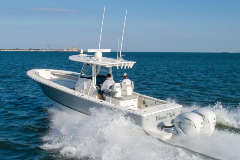 Wound Tight Yacht Photos Pics 2021 Regulator 34 Center Console boat cruising on open water.