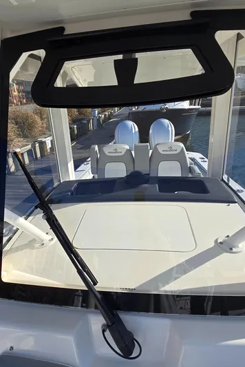 Wound Tight Yacht Photos Pics 2021 Regulator 34 Center Console boat interior with dual seats and windshield view.