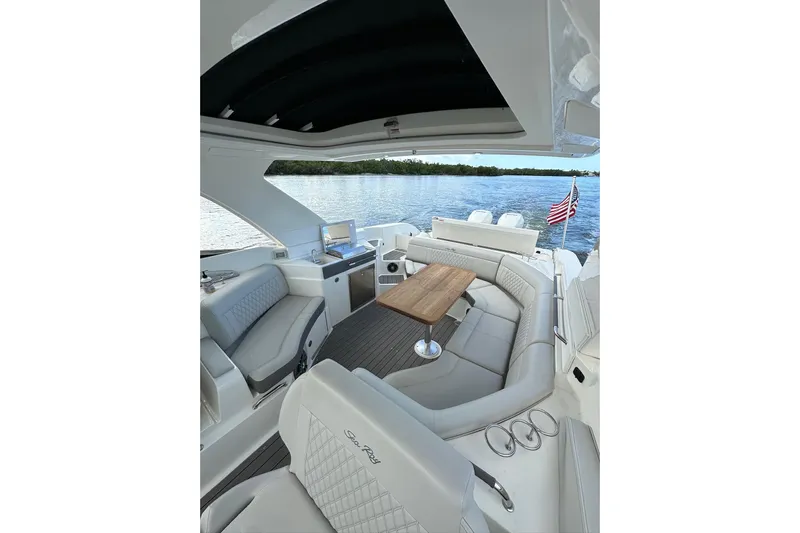 Northeast Yacht Photos Pics Luxurious 2022 Sea Ray SLX 350 Outboard boat interior with elegant seating and scenic water view.