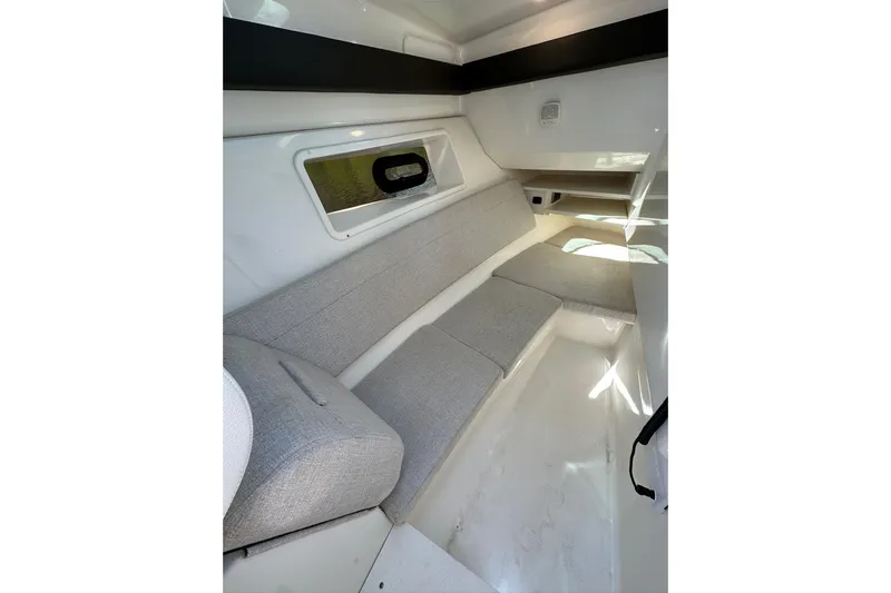 Northeast Yacht Photos Pics 2022 Sea Ray SLX 350 Outboard cabin interior with gray seating and window.