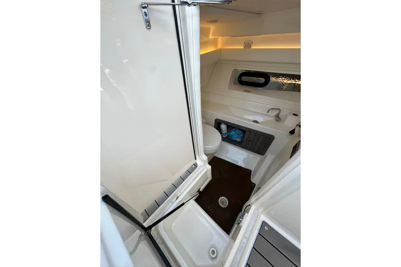 Northeast Yacht Photos Pics 2022 Sea Ray SLX 350 Outboard boat interior bathroom with sink and toilet.