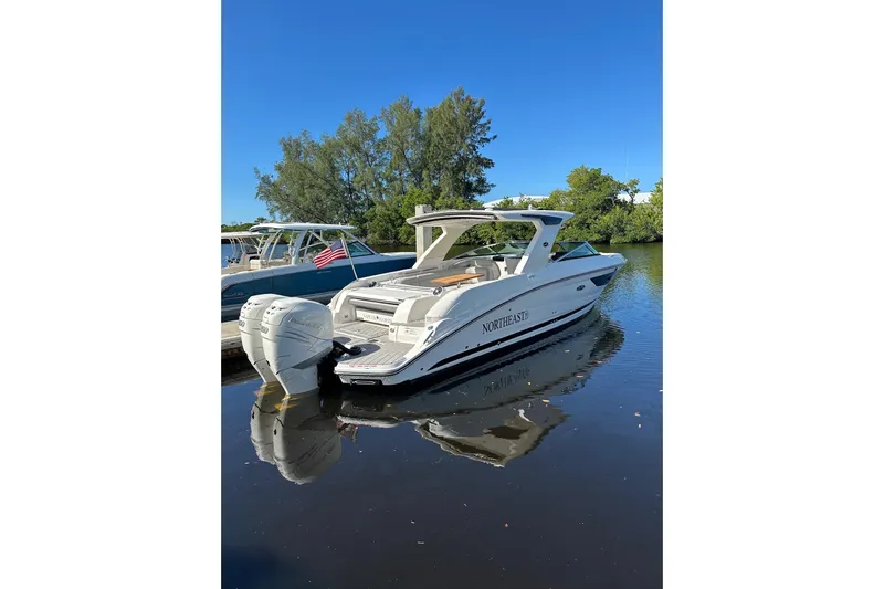 Northeast Yacht Photos Pics 2022 Sea Ray SLX 350 Outboard boat docked on calm water, clear blue sky.