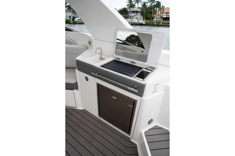 Northeast Yacht Photos Pics Outdoor kitchen on 2022 Sea Ray SLX 350 Outboard boat with grill and sink.