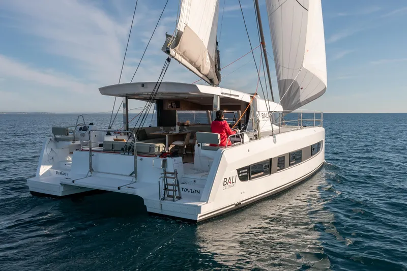  Yacht Photos Pics Modern Bali CATSMART 2026 catamaran sailing on open sea under clear skies.