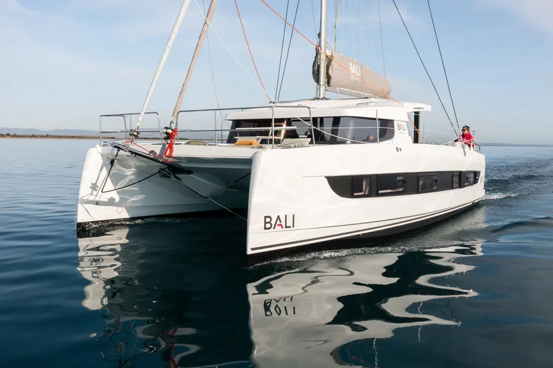  Yacht Photos Pics Modern 2026 Bali CATSMART catamaran sailing on calm waters.