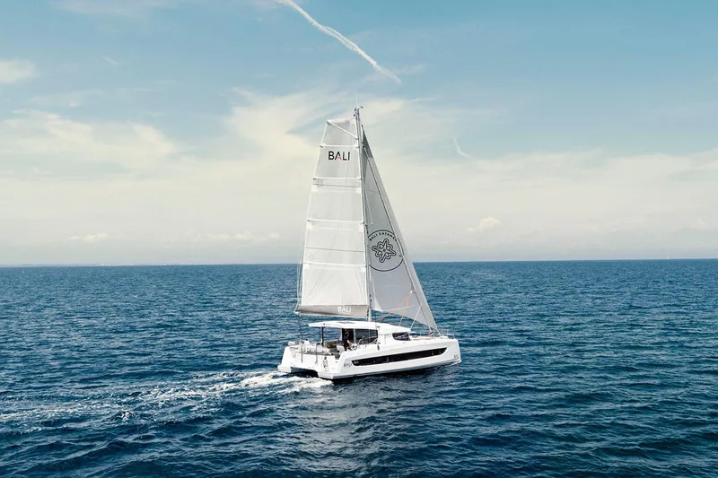  Yacht Photos Pics Sailing catamaran Bali CATSMART 2026 cruising on open sea under clear skies.