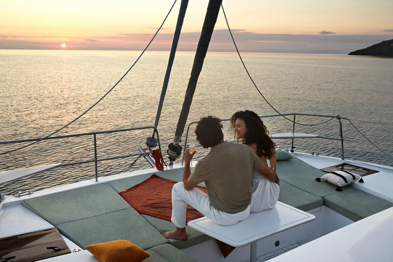  Yacht Photos Pics Couple enjoying sunset on 2026 Bali CATSMART yacht deck.