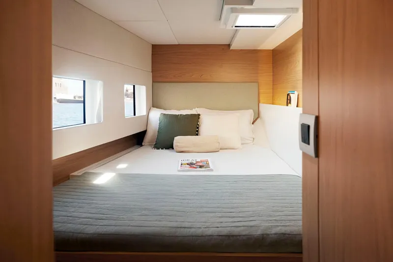  Yacht Photos Pics Luxurious cabin interior of 2026 Bali CATSMART yacht with cozy bedding and natural light.