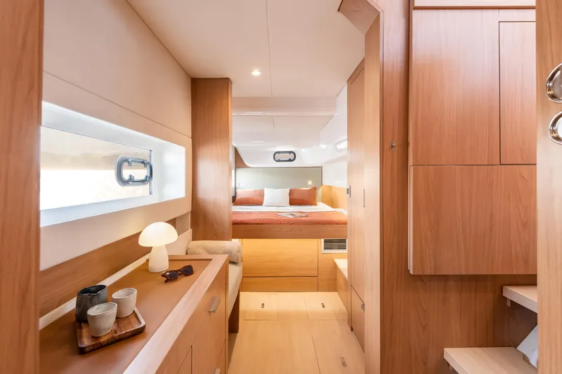 Yacht Photos Pics Luxurious interior of 2026 Bali CATSMART yacht with cozy bedroom and modern wooden design.
