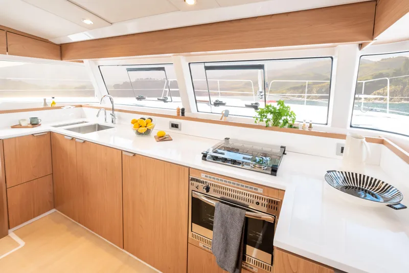  Yacht Photos Pics Modern kitchen interior on 2026 Bali CATSMART yacht, featuring sleek design and ocean views.