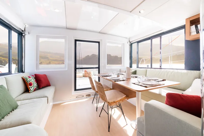  Yacht Photos Pics Modern Bali CATSMART 2026 yacht interior with elegant dining area and panoramic windows.