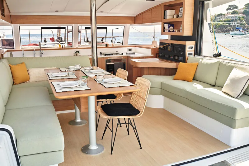  Yacht Photos Pics Luxurious Bali CATSMART 2026 catamaran interior with elegant dining area and scenic ocean view.