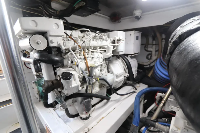 Bolita Yacht Photos Pics Engine room of a 2002 Buddy Davis 74 yacht, showcasing mechanical components.