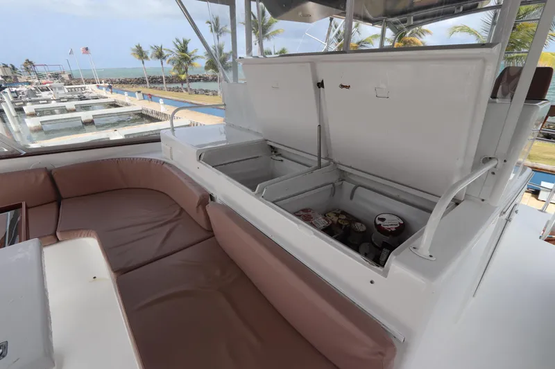 Bolita Yacht Photos Pics Luxury yacht interior with seating and open storage, Buddy Davis 74, 2002 model, dockside view.