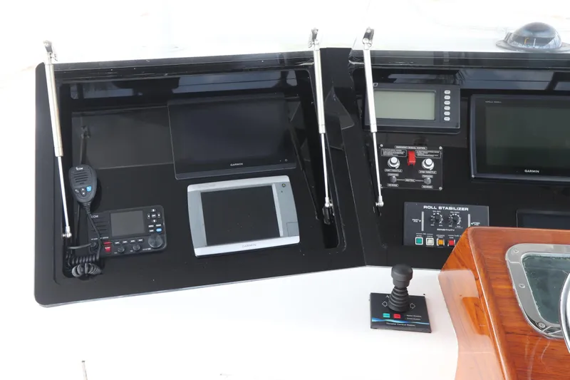 Bolita Yacht Photos Pics Control panel of a 2002 Buddy Davis 74 yacht with navigation and communication equipment.