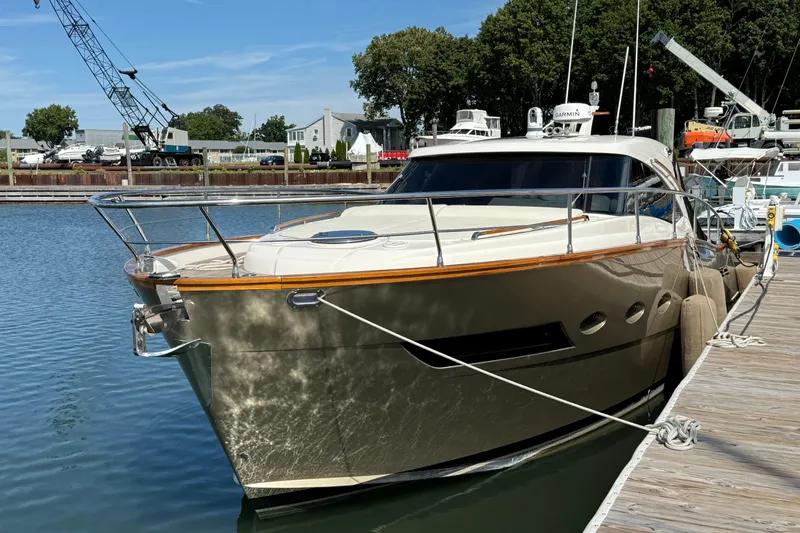  Yacht Photos Pics 2018 Chris-Craft Commander 44 yacht docked at marina, sunny day, calm water.