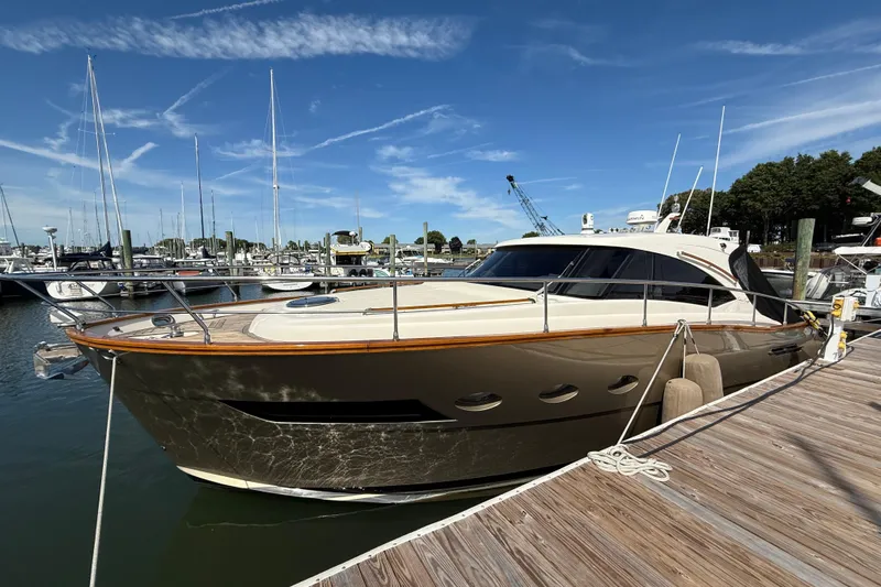  Yacht Photos Pics 2018 Chris-Craft Commander 44 yacht docked at marina under clear blue sky.