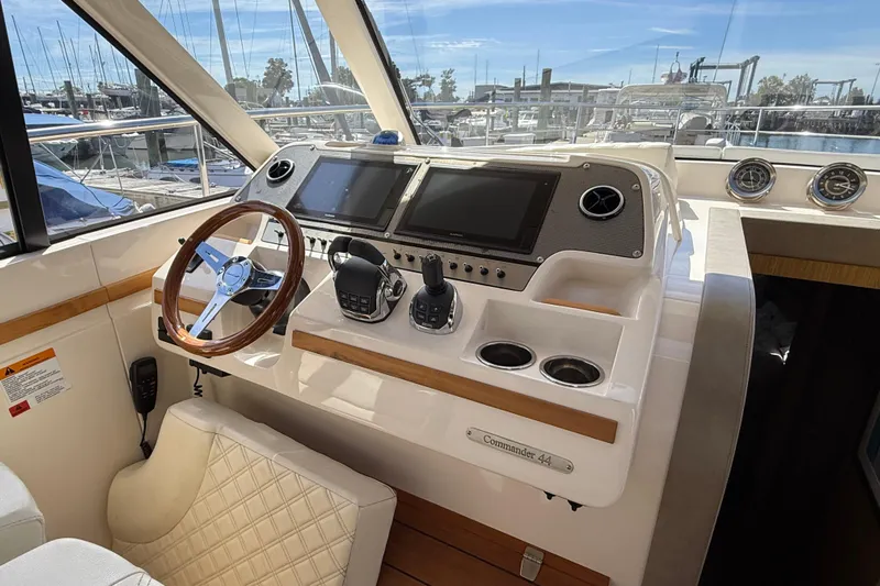 Yacht Photos Pics 2018 Chris-Craft Commander 44 helm with modern controls and wooden steering wheel.