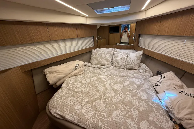  Yacht Photos Pics Luxurious bedroom interior of 2018 Chris-Craft Commander 44 yacht with elegant bedding.