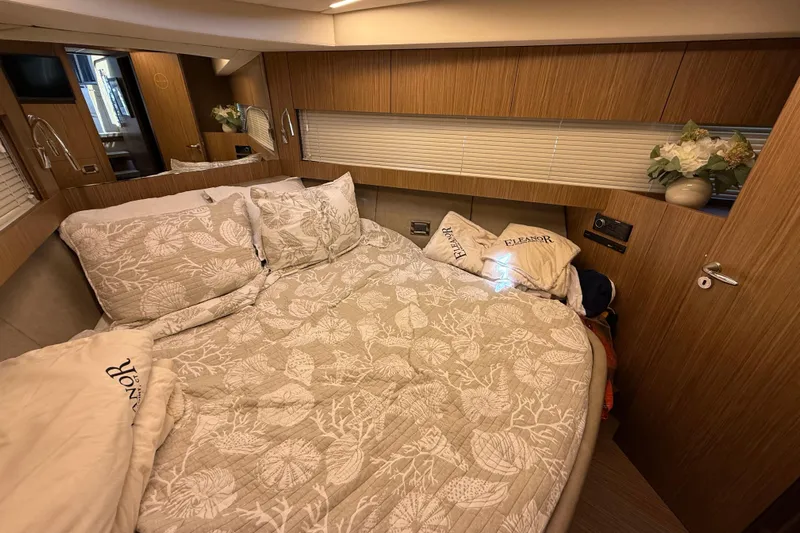  Yacht Photos Pics Luxurious bedroom interior of 2018 Chris-Craft Commander 44 yacht with elegant bedding.