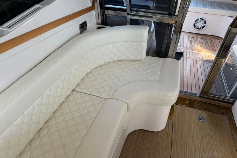  Yacht Photos Pics Luxurious interior seating of 2018 Chris-Craft Commander 44 yacht with elegant white upholstery.