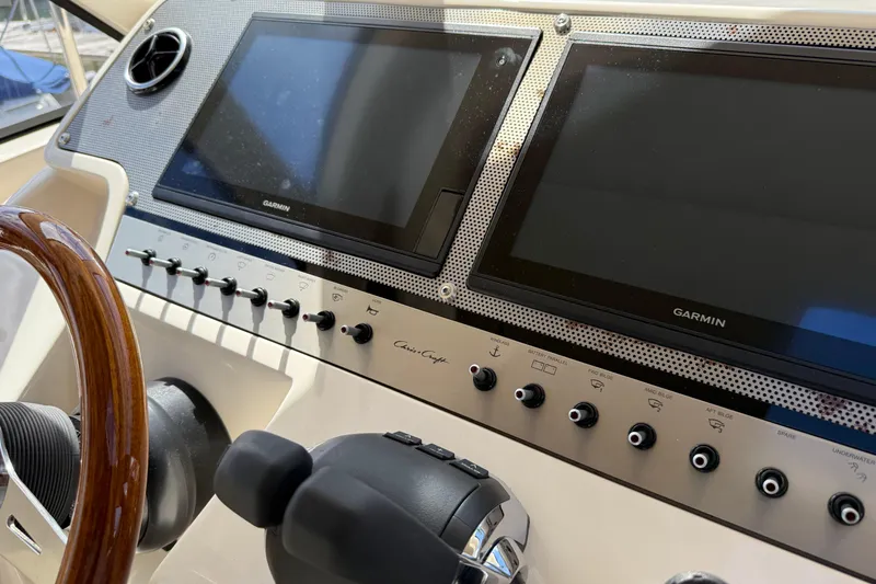  Yacht Photos Pics 2018 Chris-Craft Commander 44 helm with Garmin displays and control panel.