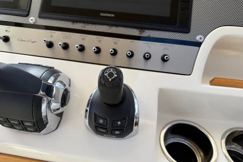  Yacht Photos Pics Control panel of 2018 Chris-Craft Commander 44 with joystick and throttle.