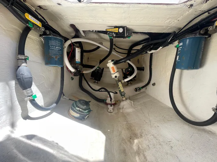 Motivated Yacht Photos Pics 2022 Contender 25 Tournament boat interior showing fuel lines and filters.