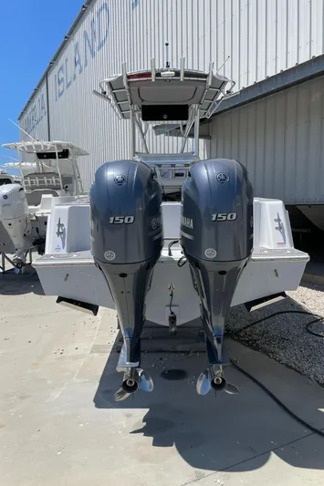 Motivated Yacht Photos Pics 2022 Contender 25 Tournament boat with dual Yamaha 150 engines, docked at a marina.