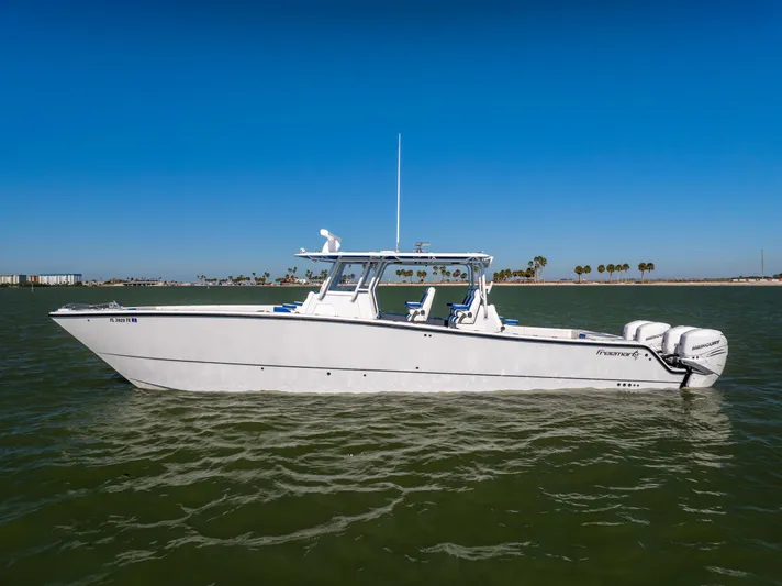  Yacht Photos Pics 2022 Freeman 42 LR boat on calm water under clear blue sky.