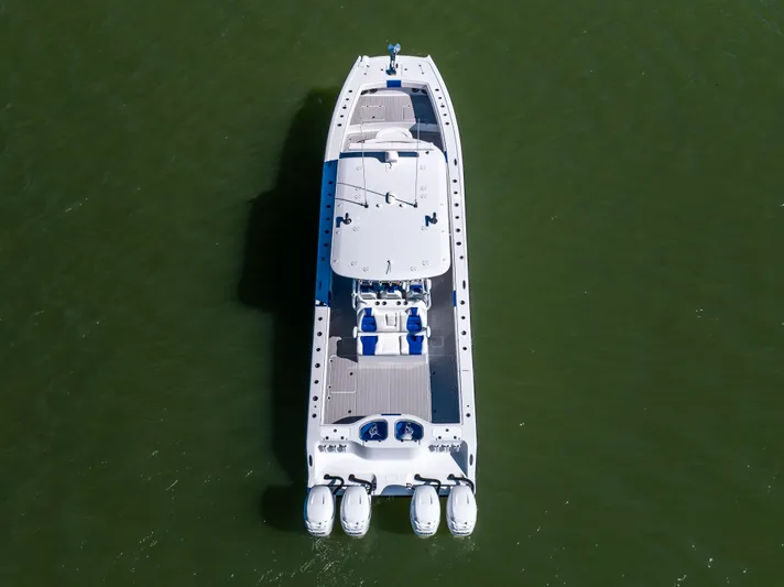  Yacht Photos Pics Aerial view of 2022 Freeman 42 LR boat on green water.
