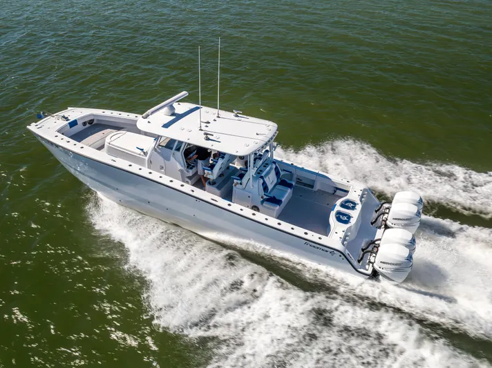  Yacht Photos Pics Freeman 42 LR 2022 boat cruising on open water, aerial view.