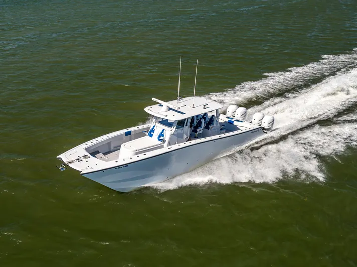  Yacht Photos Pics Freeman 42 LR 2022 boat cruising on open water, showcasing sleek design and powerful engines.