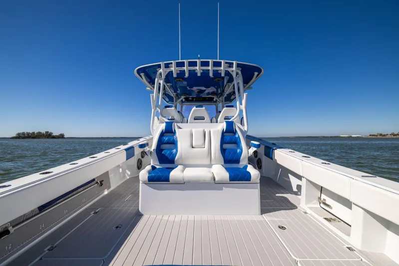  Yacht Photos Pics 2022 Freeman 42 LR boat with blue and white seating on open water.