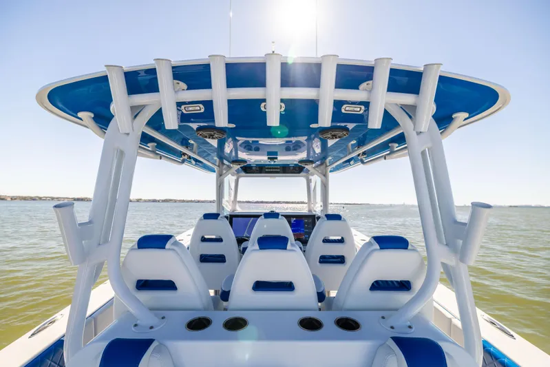  Yacht Photos Pics 2022 Freeman 42 LR boat interior with blue and white seating on open water.