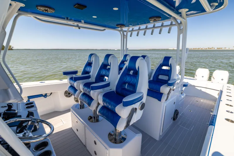  Yacht Photos Pics Freeman 42 LR 2022 boat interior with blue and white seating, ocean view.
