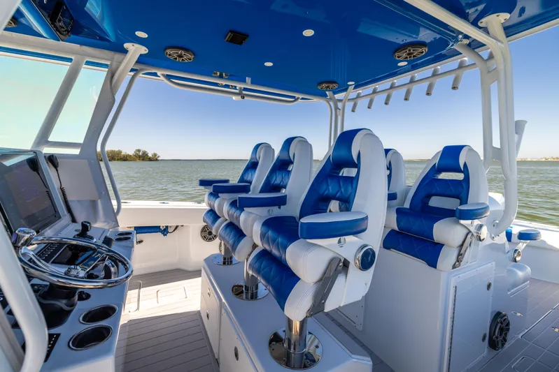  Yacht Photos Pics Luxury seating on 2022 Freeman 42 LR boat with blue and white interior.
