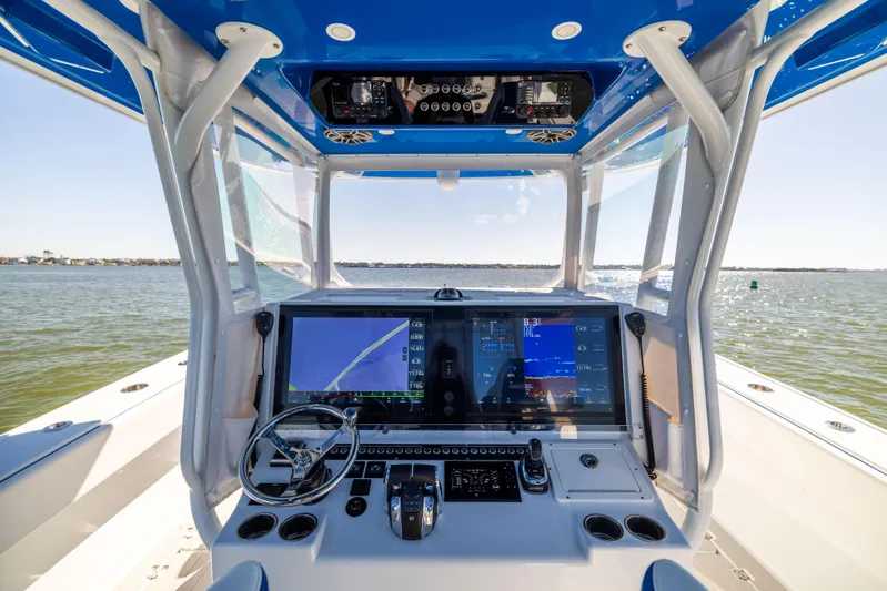  Yacht Photos Pics Freeman 42 LR 2022 boat cockpit with advanced navigation system on open water.
